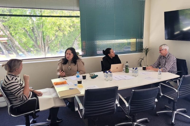 A team engaged in a strategy session highlighting Xseed Lead's Stakeholder Mapping and Engagement services.